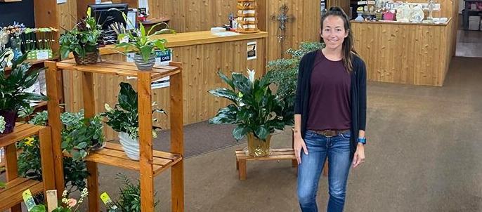 Strong new owner of floral shop